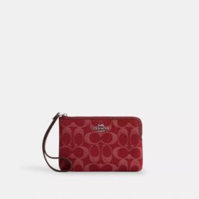 Handgelenktasche mit Reissverschluss an der Ecke aus charakteristischem Denim