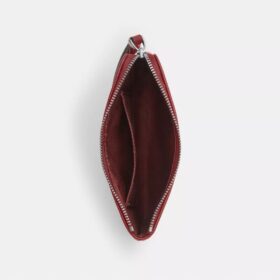 Handgelenktasche mit Reissverschluss an der Ecke aus charakteristischem Denim