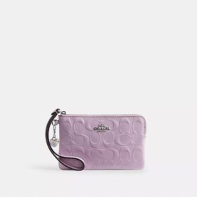 Handgelenktasche mit Reissverschluss an der Ecke aus Signature-Leder mit Herz-Anhänger