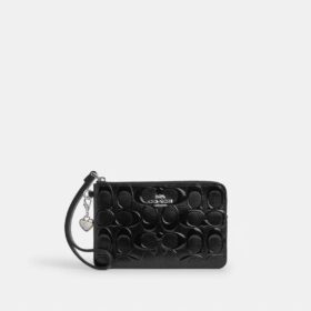 Handgelenktasche mit Reissverschluss an der Ecke aus Signature-Leder mit Herz-Anhänger