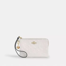 Handgelenktasche mit Reissverschluss an der Ecke aus Signature-Leder mit Herz-Anhänger
