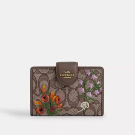 Mittlere Eck-Geldbörse mit Reissverschluss aus charakteristischem Jacquard mit Blumenstickerei